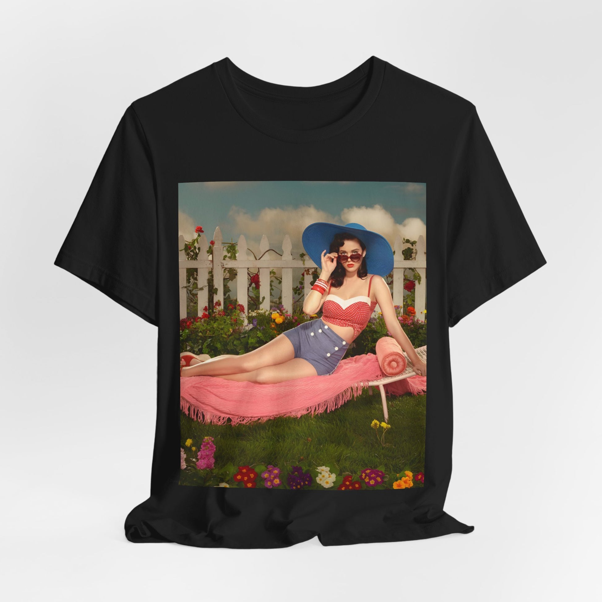 A black graphic t-shirt featuring a graphic related to Katy Perry's "California Gurls" song, with beach vibes.