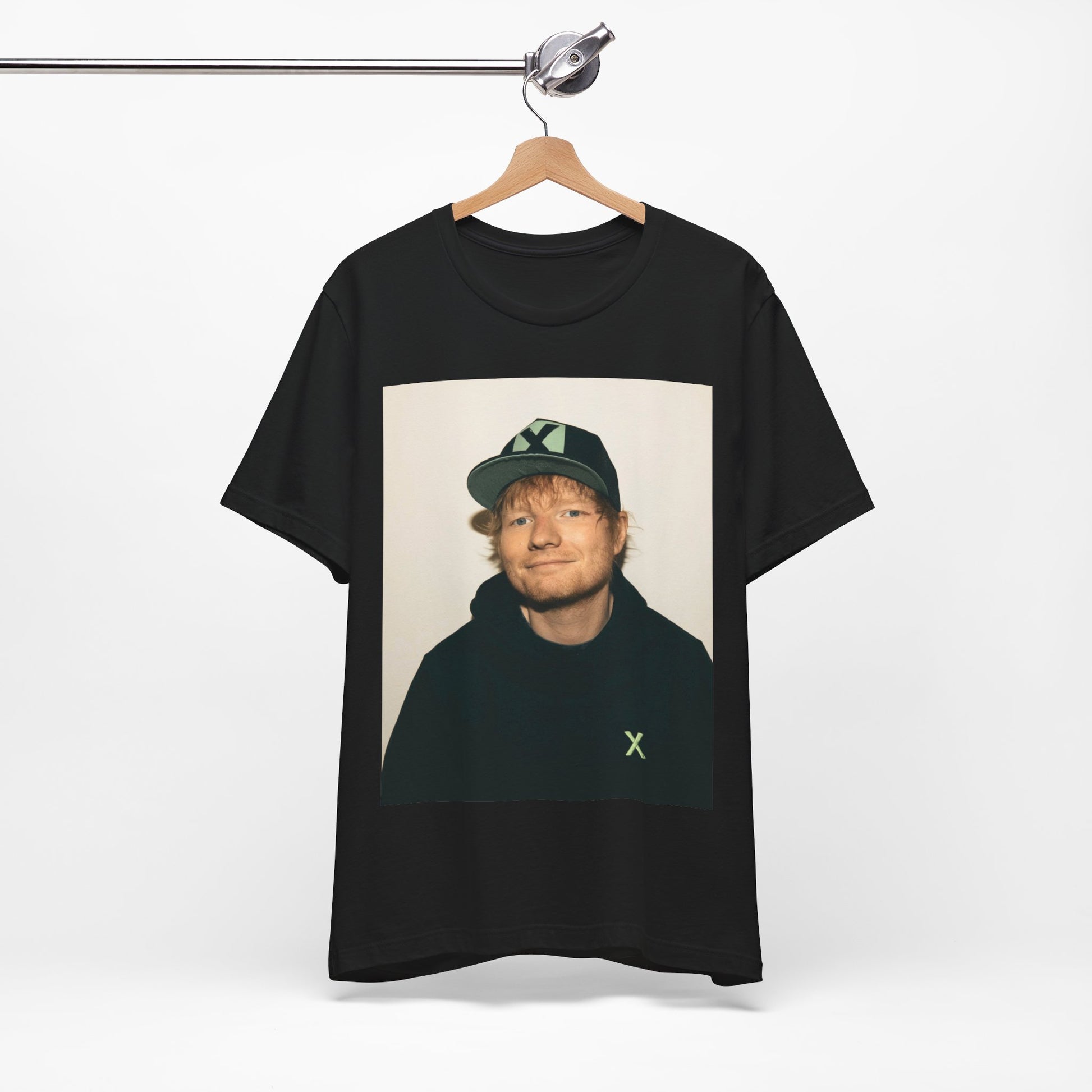 A black graphic t-shirt featuring a glamorous graphic of Ed Sheeran as a global tour icon.