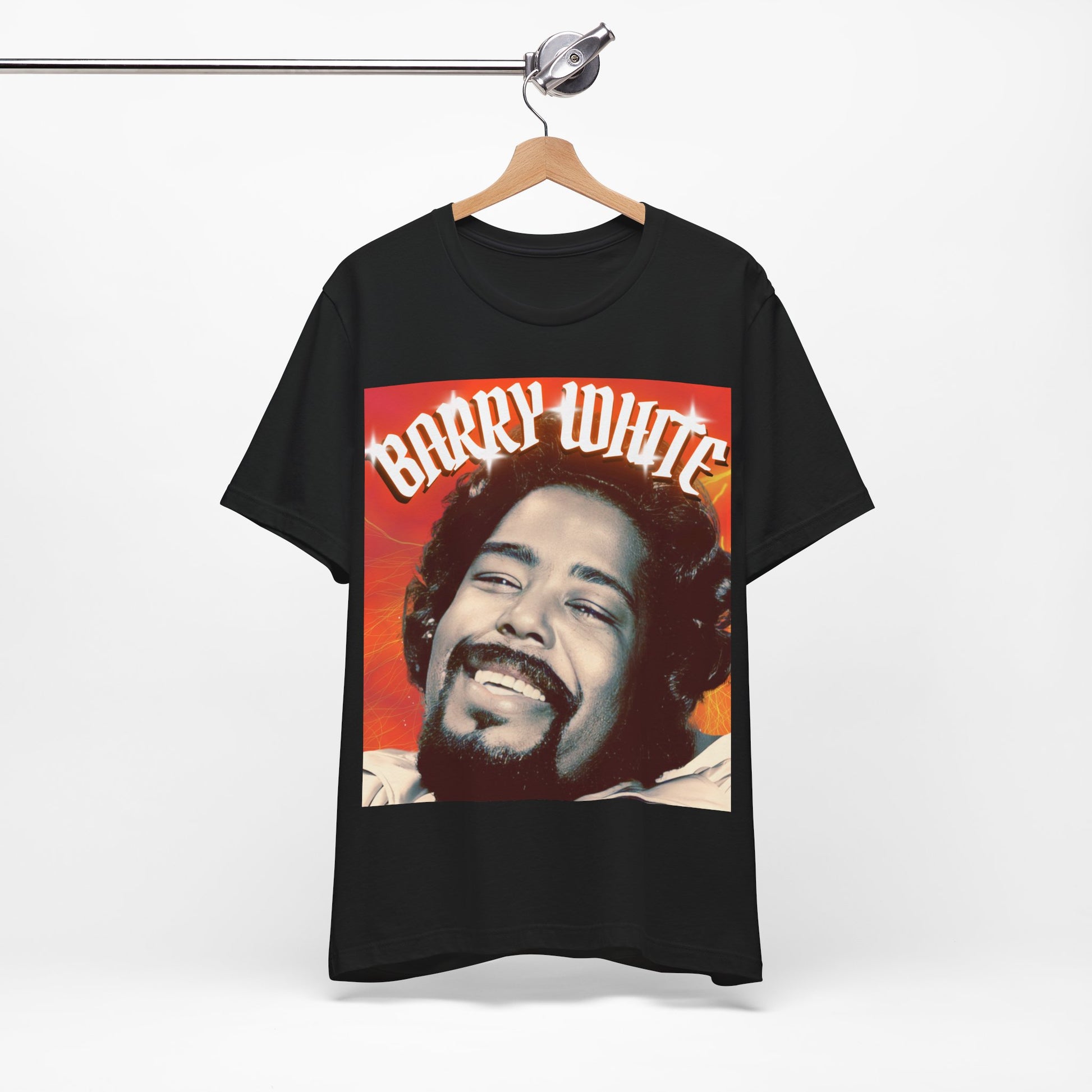 A black graphic t-shirt featuring a graphic of Barry White, emphasizing his iconic soulful presence from the 1970s.