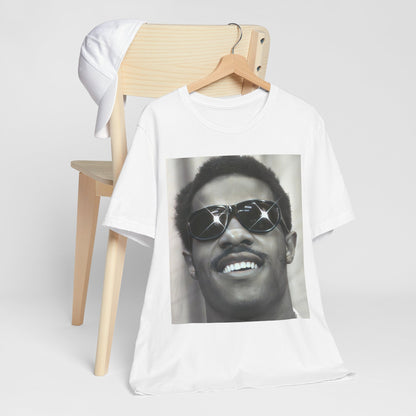 A black graphic t-shirt featuring a 70s funk aesthetic black and white graphic or photo of Stevie Wonder.
