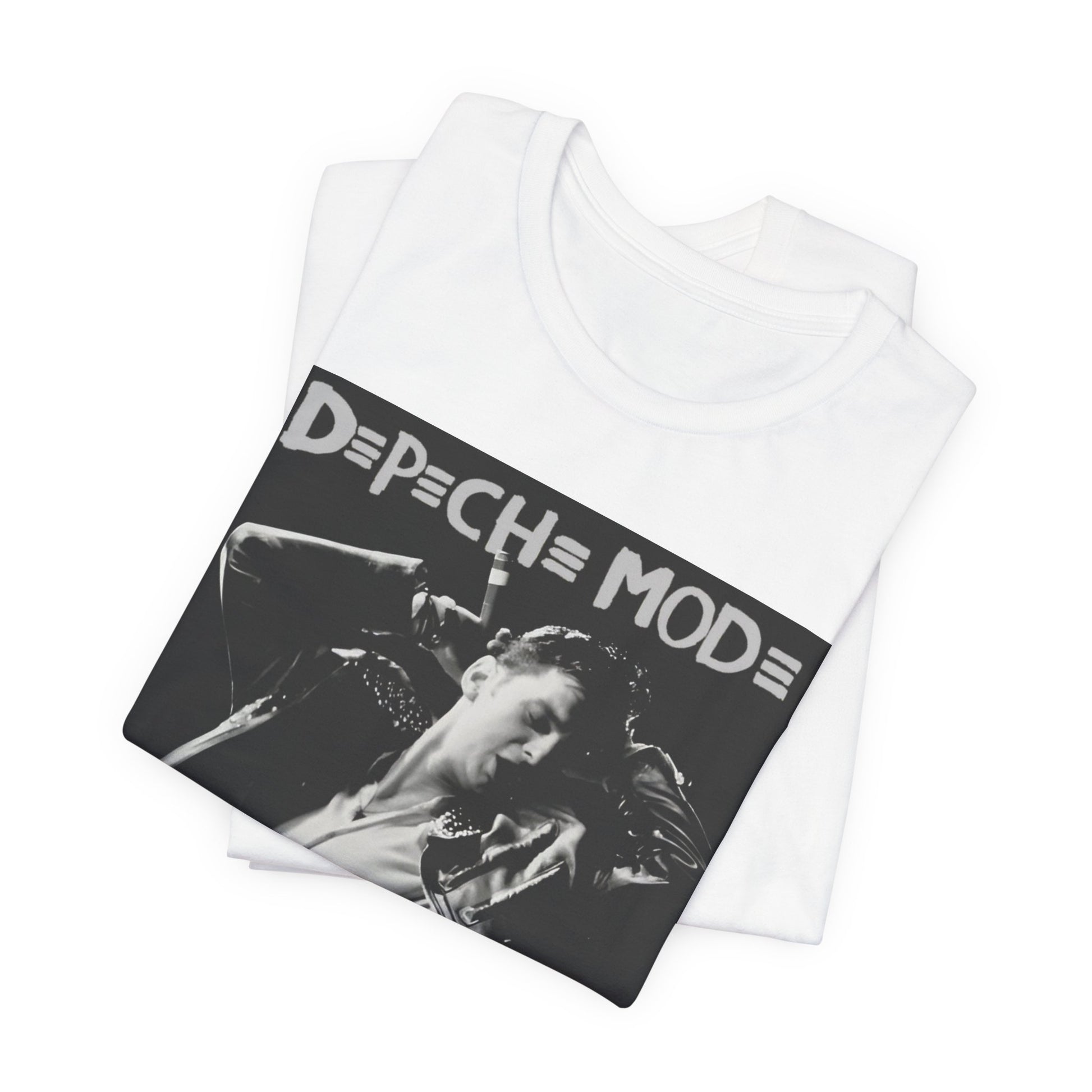 A black graphic t-shirt featuring a black and white graphic or photo of Depeche Mode performing live on stage.