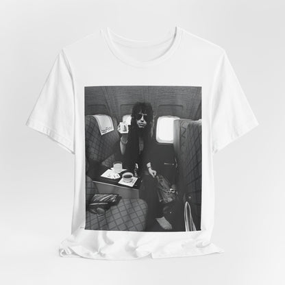 A black graphic t-shirt featuring a vintage 70s-style illustration of an airplane with Aerosmith branding, representing their tour plane from that era.
