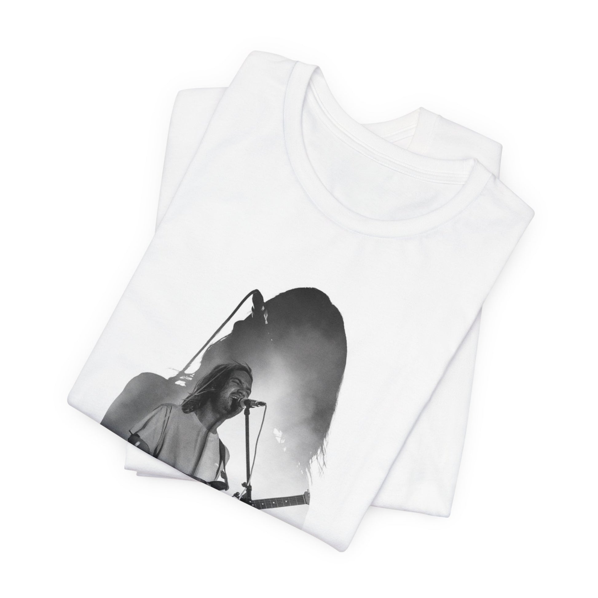 A black graphic t-shirt featuring a black and white, monochrome graphic or photo of Tame Impala.