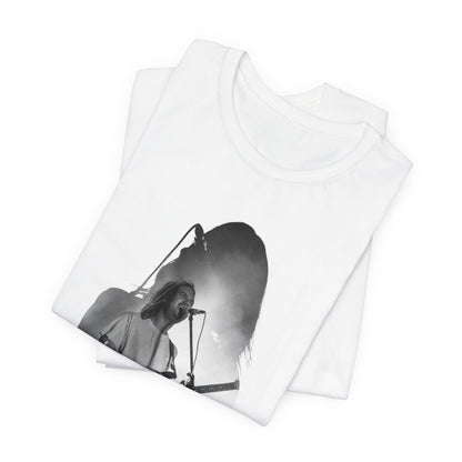 A black graphic t-shirt featuring a black and white, monochrome graphic or photo of Tame Impala.