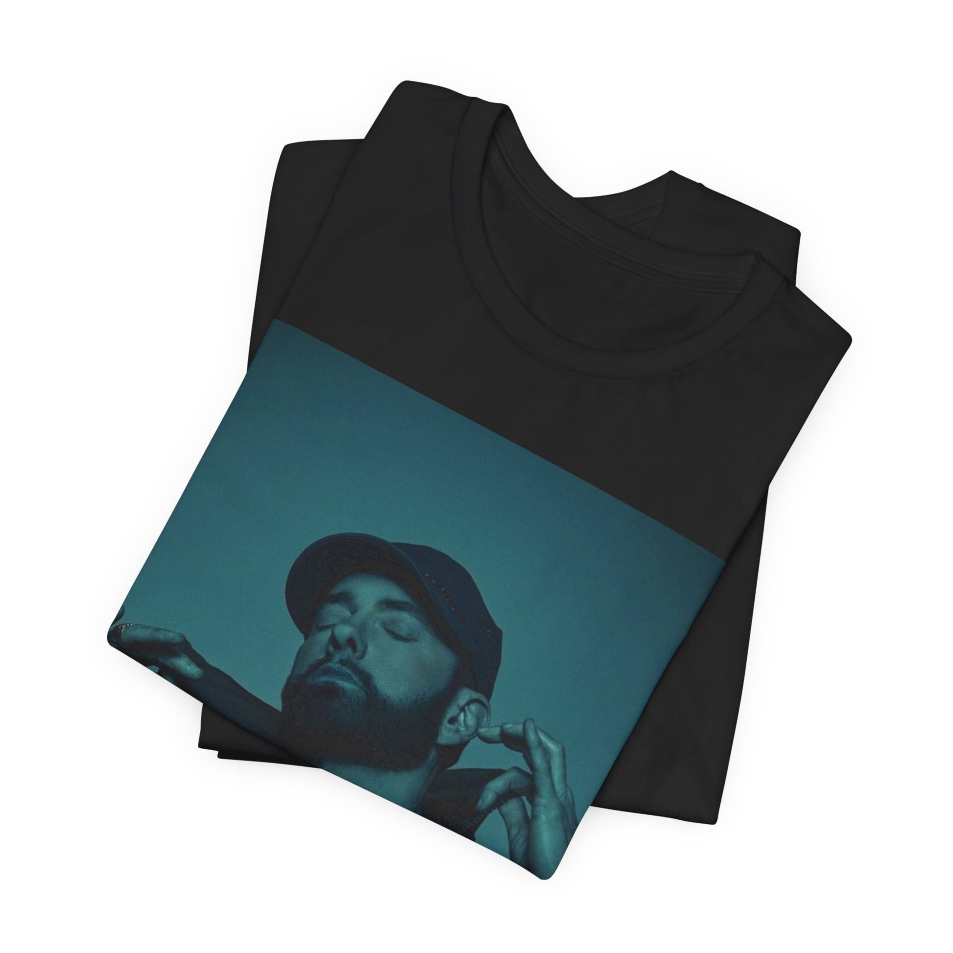 A black graphic t-shirt featuring a graphic of Eminem as a 'Rap God'.