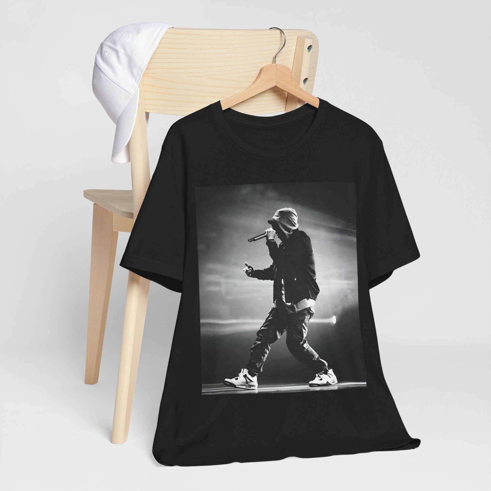 A black graphic t-shirt featuring a boxy hip hop aesthetic graphic of Eminem.