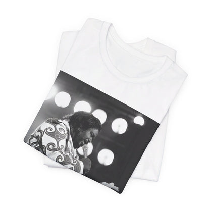 A black graphic t-shirt featuring a graphic or photo of Barry White performing live on stage in the 1970s.