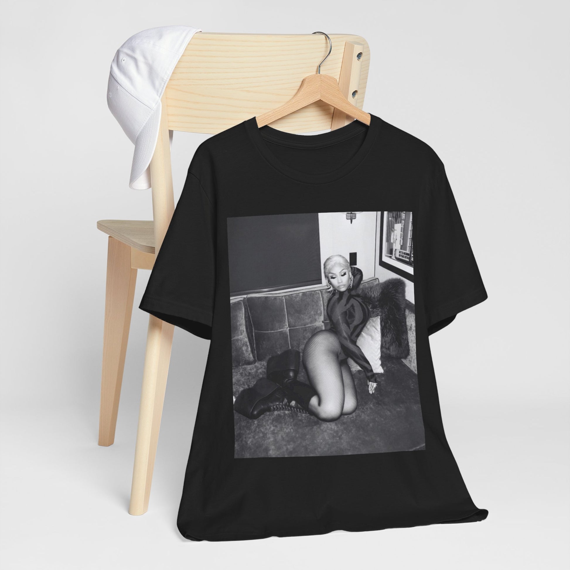 A black graphic t-shirt featuring a fierce black and white glamour graphic of Nicki Minaj.