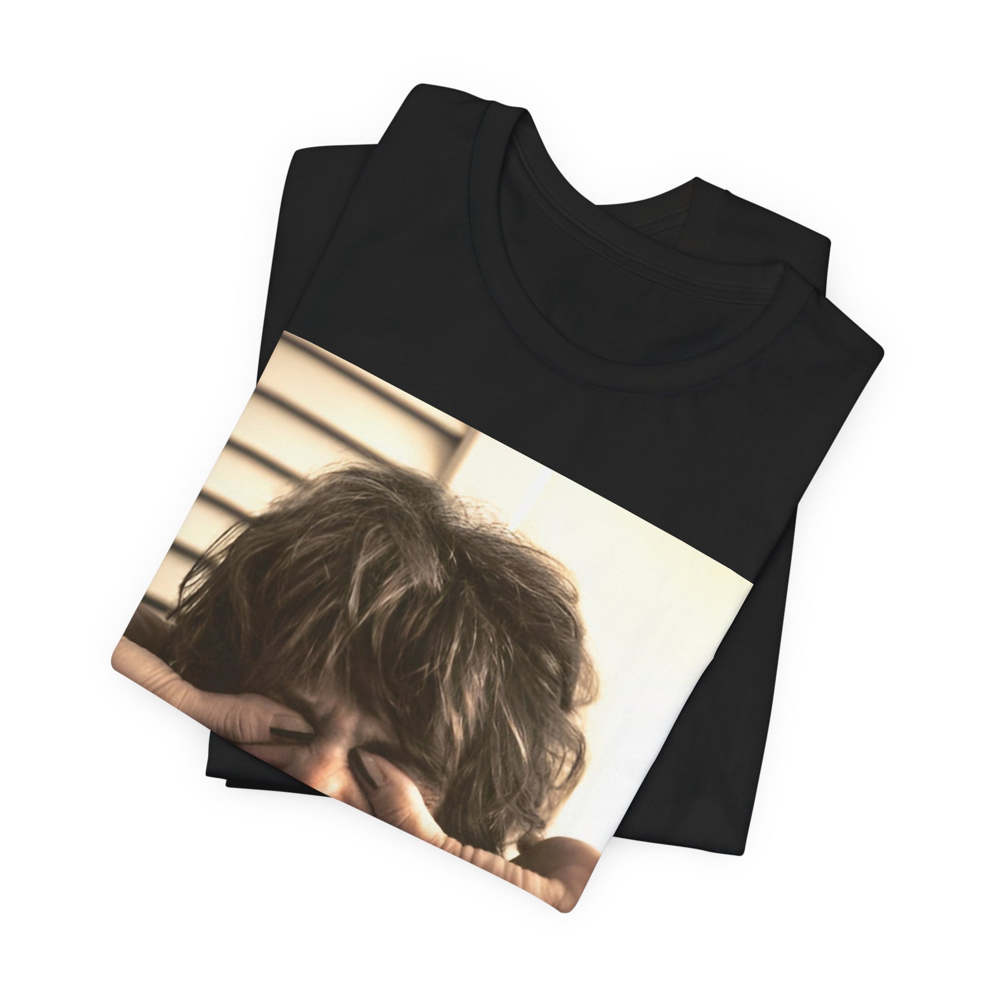 A black graphic t-shirt featuring a vintage 70s band photo of Aerosmith, showing the members in their iconic early looks.