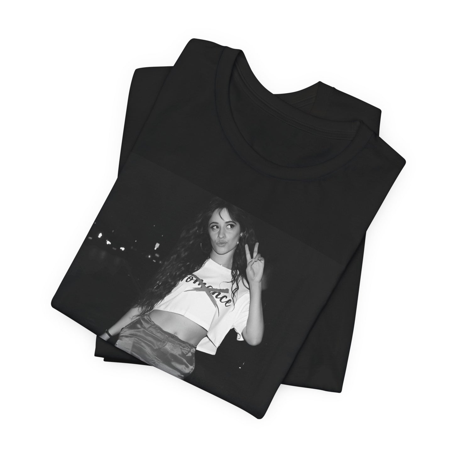 A black graphic t-shirt featuring a photo of Camila Cabello from her "Romance" album era.