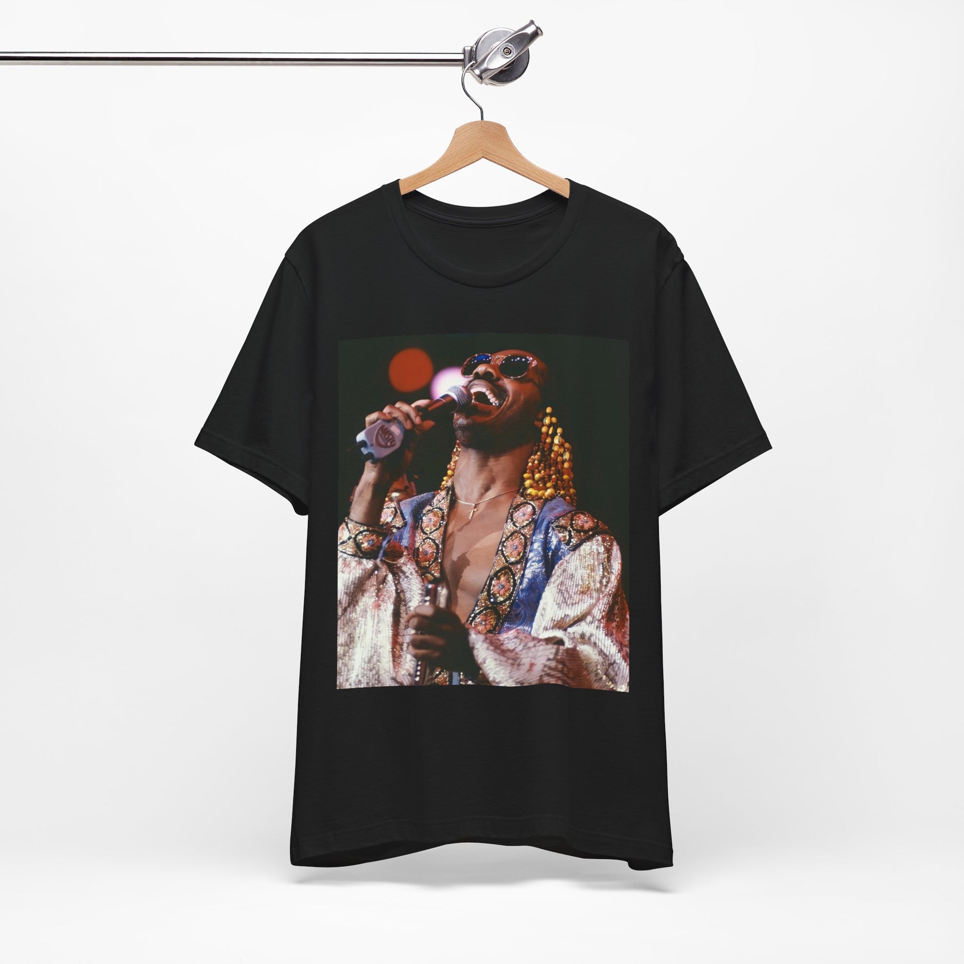 A black graphic t-shirt featuring a 70s vintage soul icon graphic of Stevie Wonder.