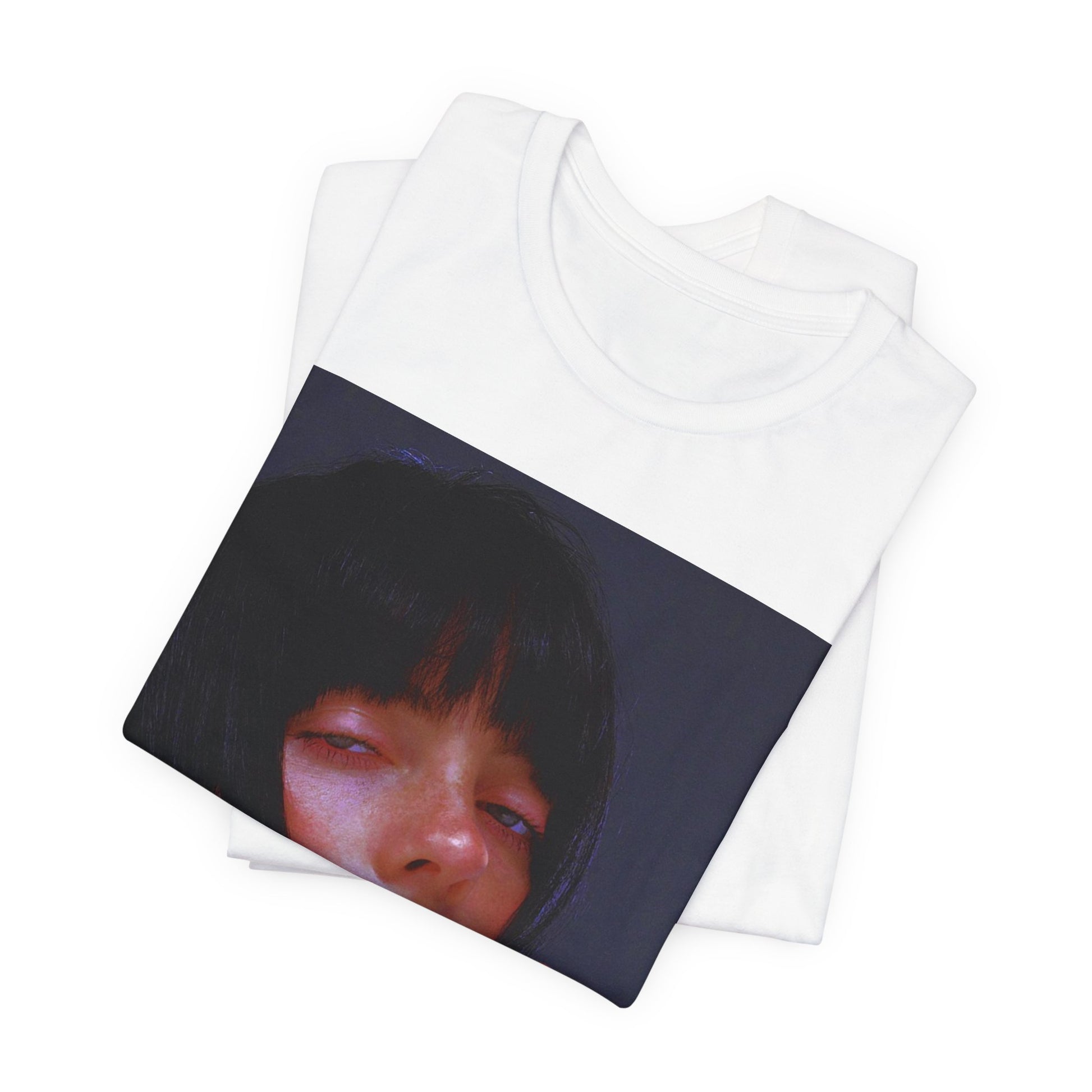 An intense, artistic photo of Billie Eilish with a bloody nose, conveying a sense of raw power, printed on a graphic t-shirt.