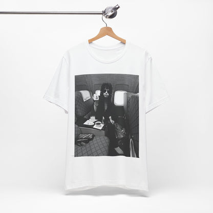 A black graphic t-shirt featuring a vintage 70s-style illustration of an airplane with Aerosmith branding, representing their tour plane from that era.