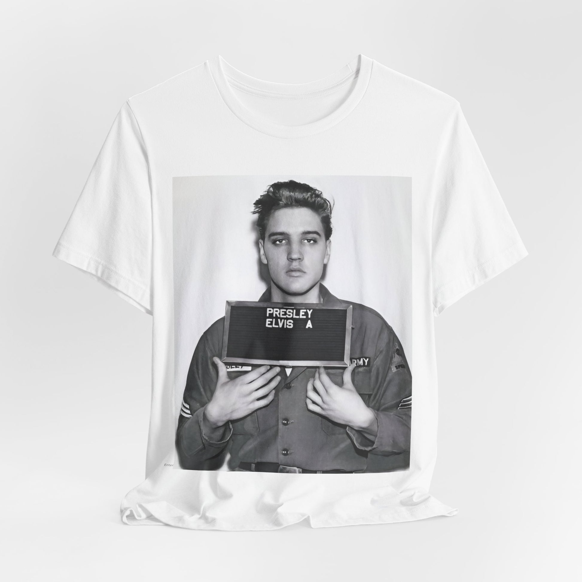 A black graphic t-shirt featuring a retro mugshot photo of Elvis Presley.