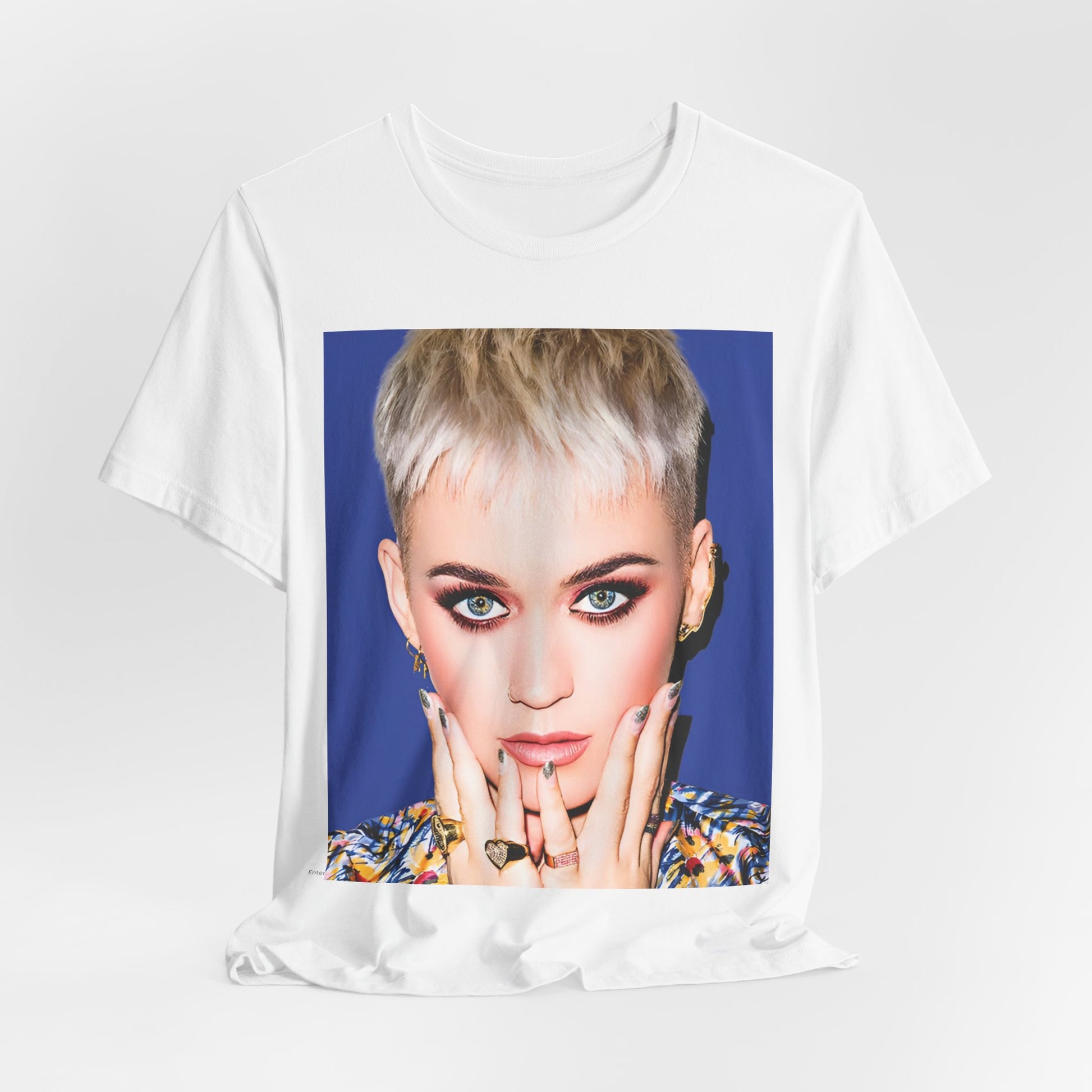 A black graphic t-shirt featuring a graphic of Katy Perry as a global pop phenomenon.