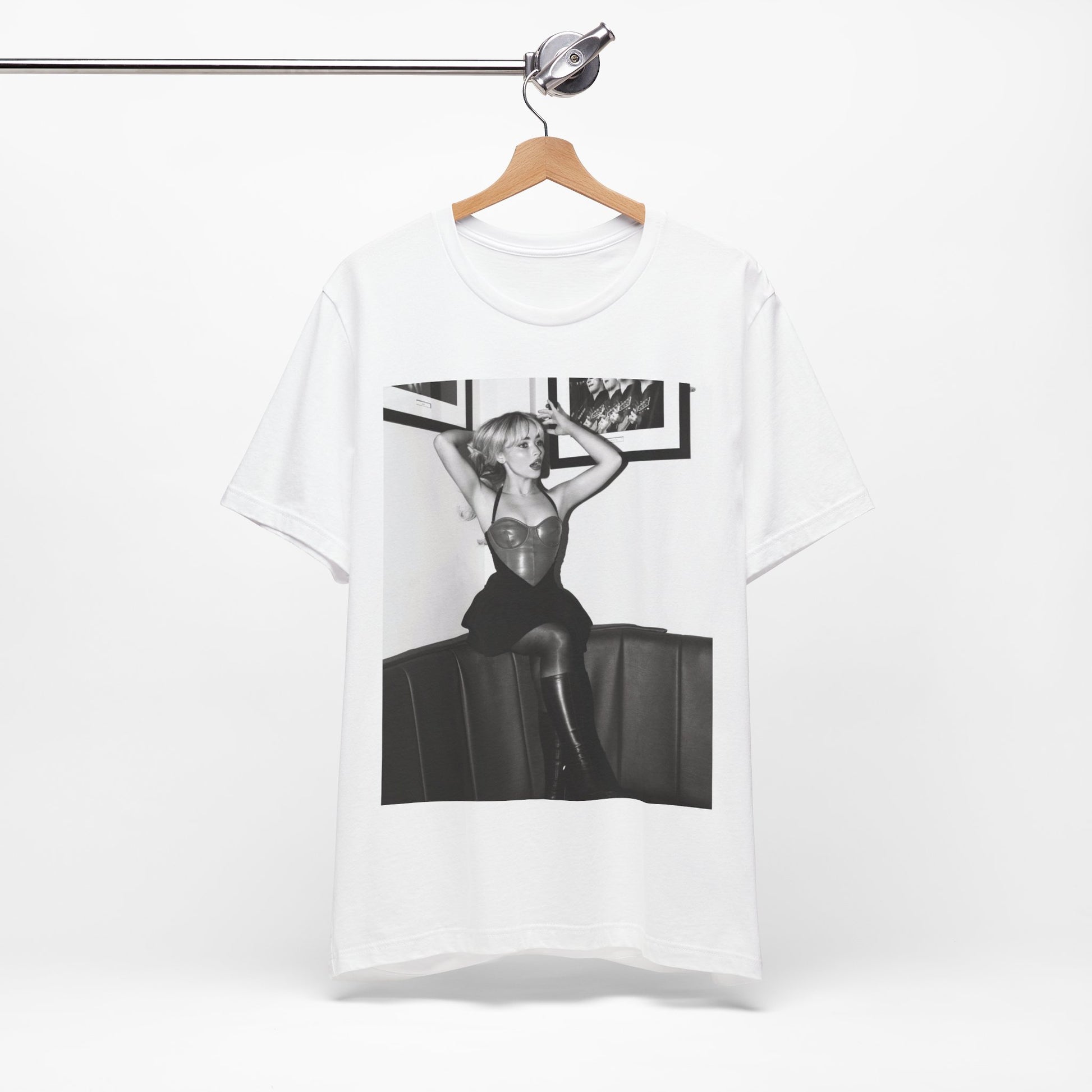 A black graphic t-shirt featuring a black and white graphic of Sabrina Carpenter as a pop princess.