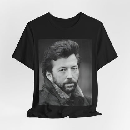 A black graphic t-shirt featuring a 70s rock aesthetic graphic of Eric Clapton.