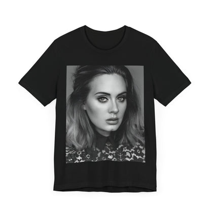 A black graphic t-shirt featuring a classic black and white, monochrome portrait of Adele, showing her with a serene or thoughtful expression.
