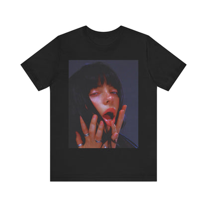 An intense, artistic photo of Billie Eilish with a bloody nose, conveying a sense of raw power, printed on a graphic t-shirt.