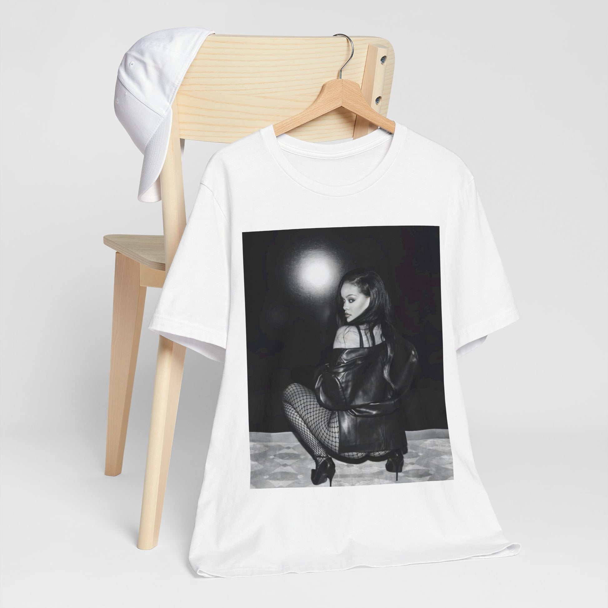 A black graphic t-shirt featuring a black and white sexy graphic of Rihanna.