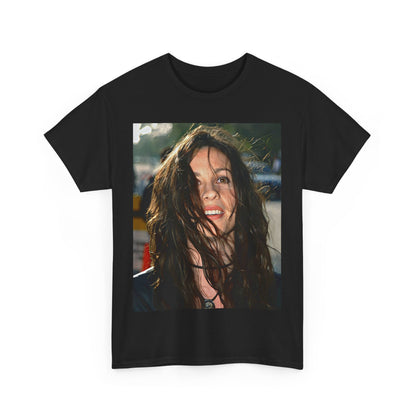 A black graphic t-shirt featuring a stylized graphic of Alanis Morissette from her 90s grunge era, with a raw and intense aesthetic.
