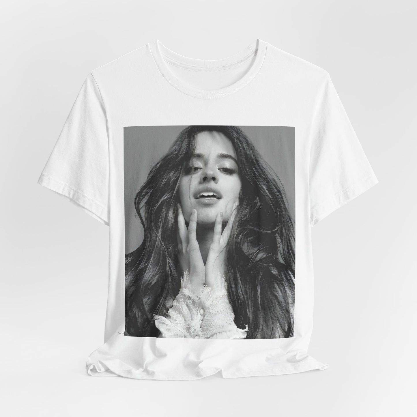 A black graphic t-shirt featuring a black and white portrait photo of Camila Cabello.