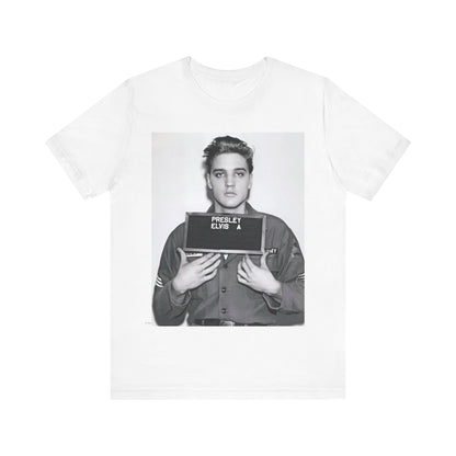 A black graphic t-shirt featuring a retro mugshot photo of Elvis Presley.