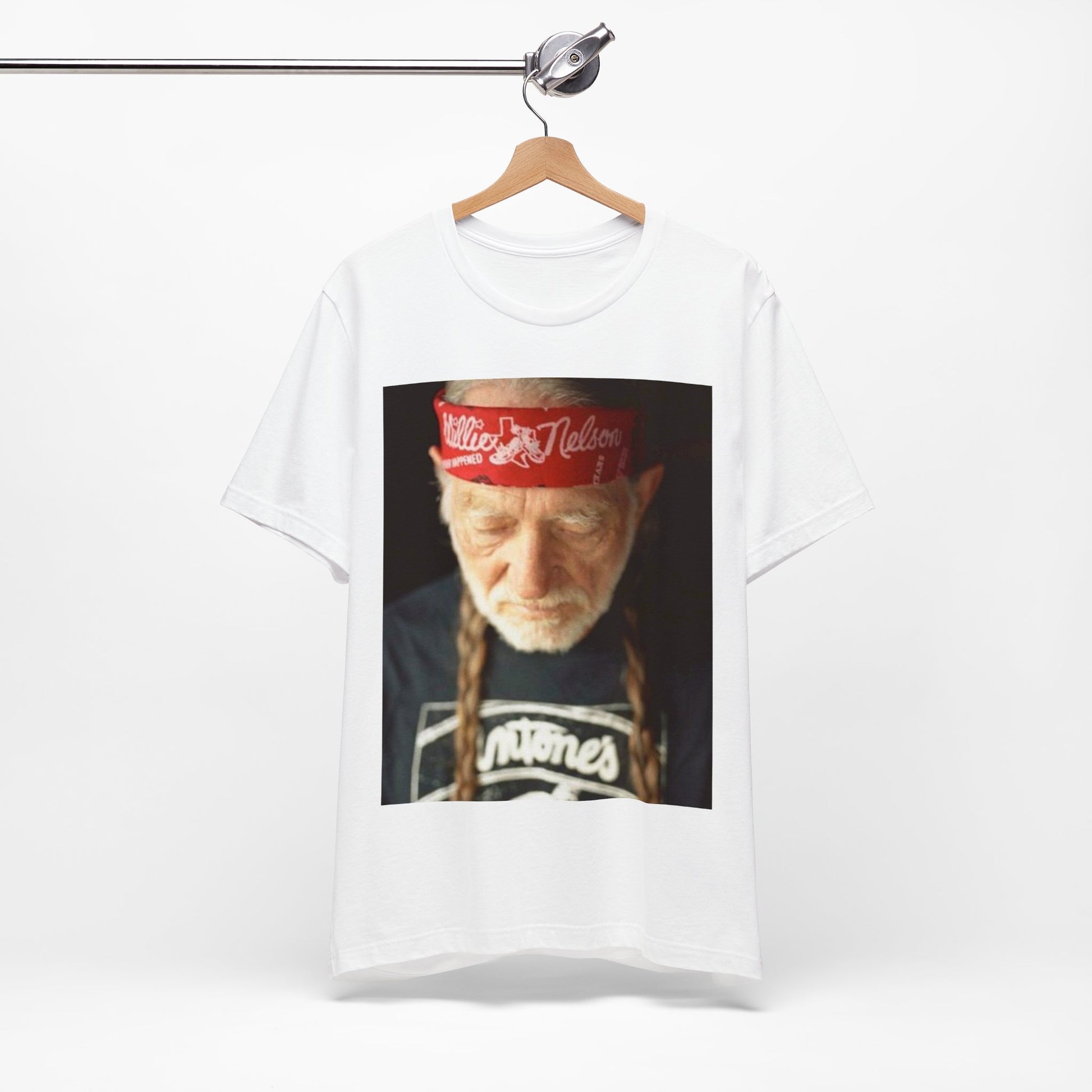 A black graphic t-shirt featuring a Texas music aesthetic graphic of Willie Nelson.