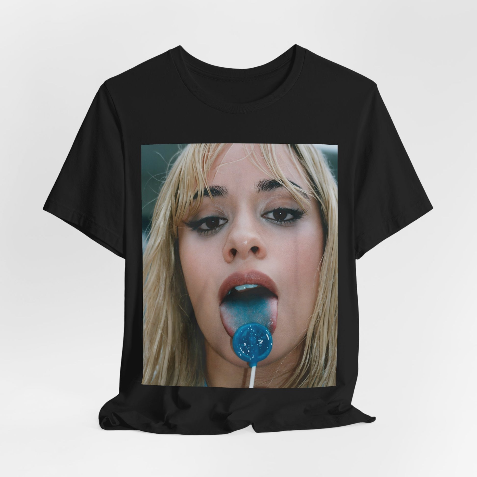 A black graphic t-shirt featuring a graphic related to Camila Cabello's C,XOXO album, with an aesthetic design.