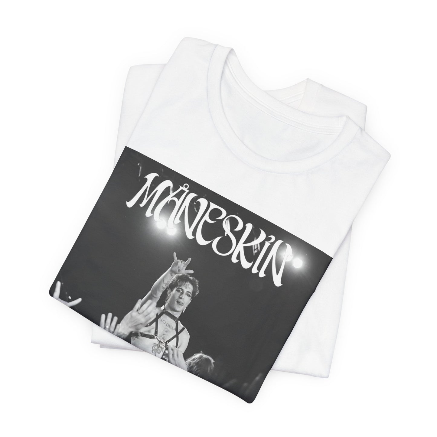 A black graphic t-shirt featuring a graphic or photo of Maneskin performing live.
