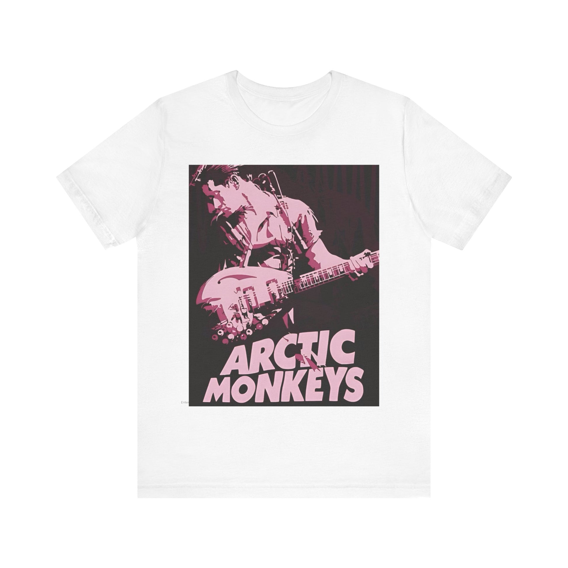 A black graphic t-shirt featuring the Arctic Monkeys logo in a prominent pink color, creating an aesthetic look.