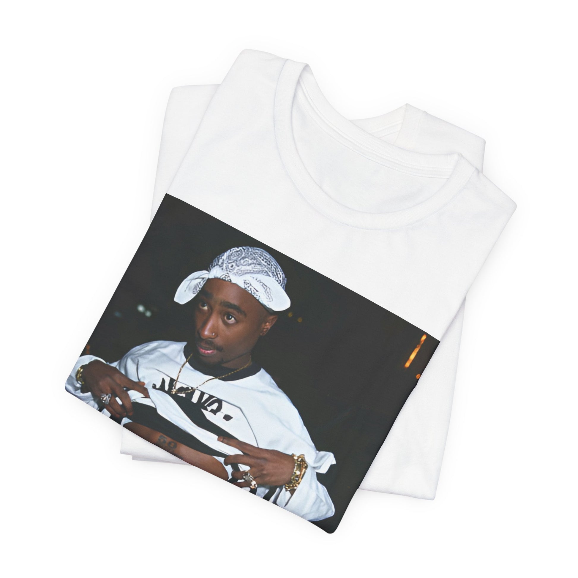 A black graphic t-shirt featuring a graphic of Tupac Shakur (2Pac).