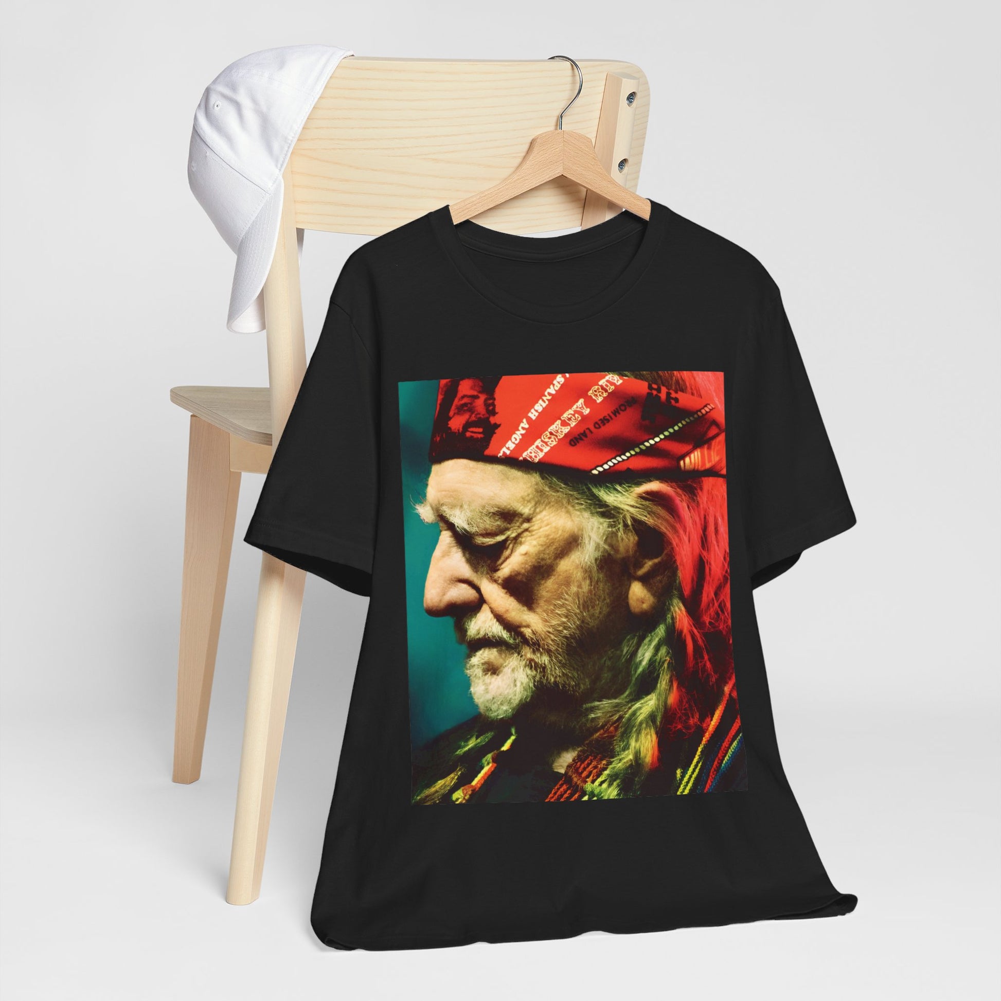 A black graphic t-shirt featuring a graphic related to Willie Nelson's 'Red Headed Stranger' album era.