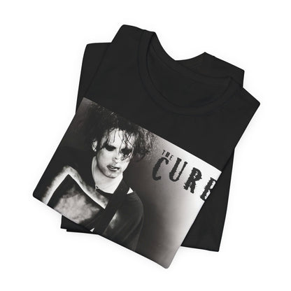 A black graphic t-shirt featuring a vintage goth rock graphic of The Cure.