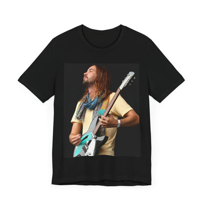 A black graphic t-shirt featuring a vintage indie rock graphic of Tame Impala.