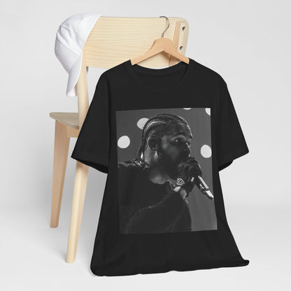 A black graphic t-shirt featuring a classic black and white style graphic of Drake.