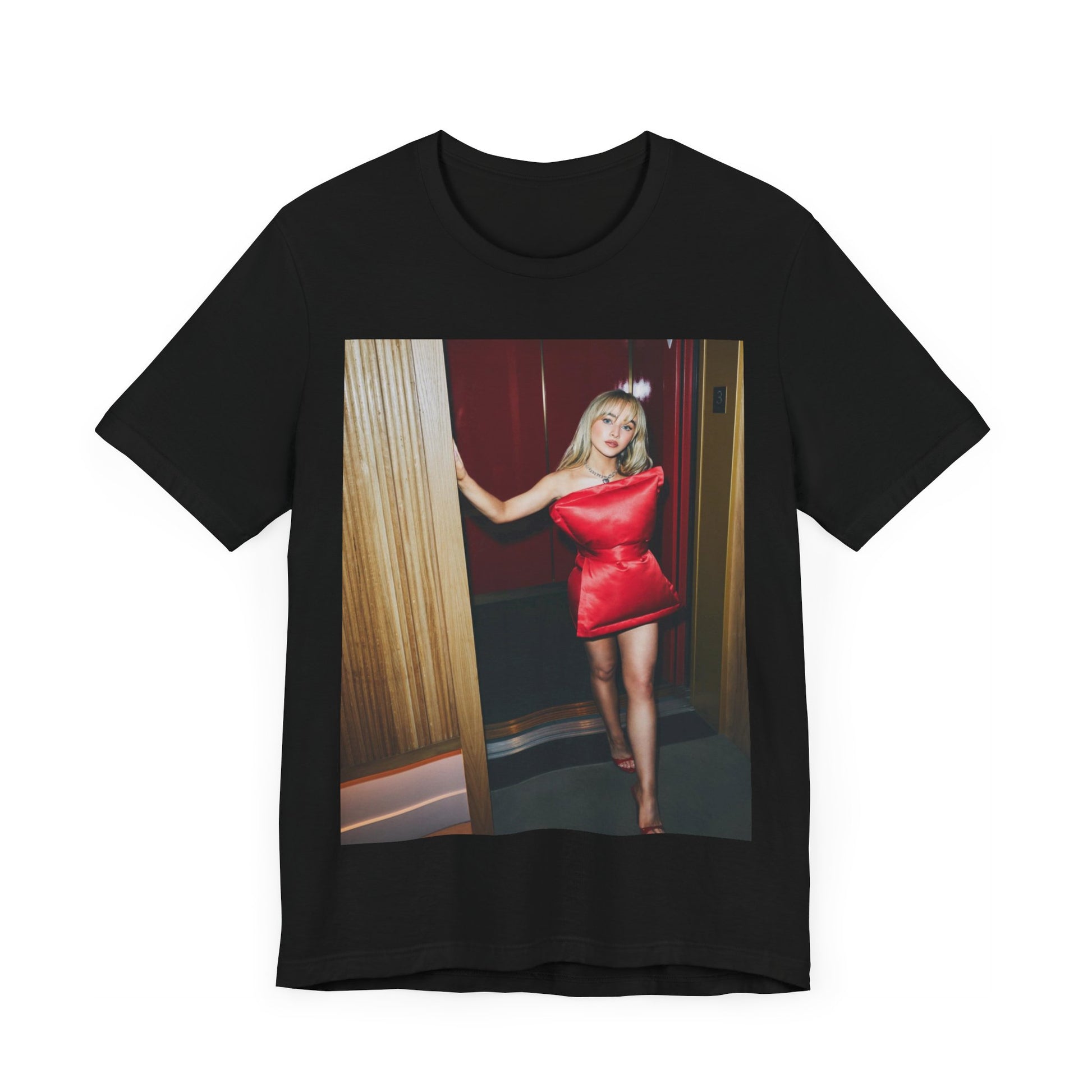 A black graphic t-shirt featuring a graphic of Sabrina Carpenter with 'hot pop vibes'.