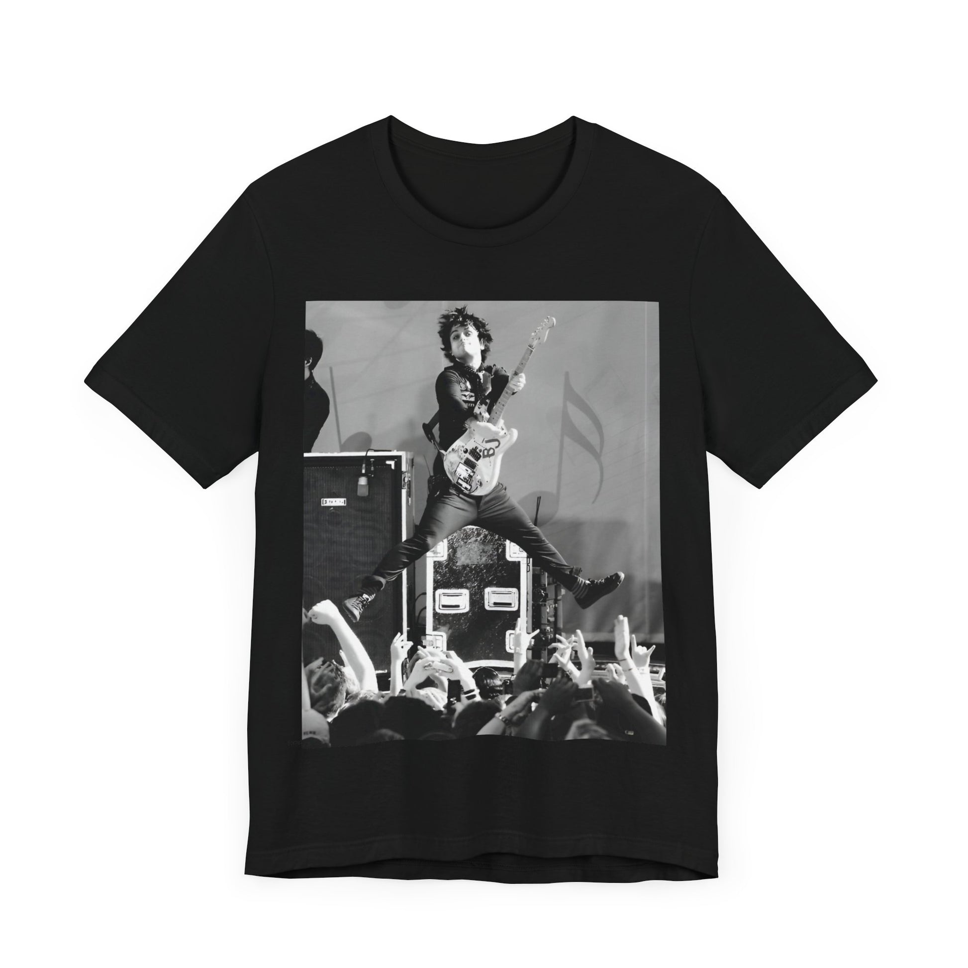 A black graphic t-shirt featuring a graphic of Billie Joe Armstrong from Green Day jumping on stage during a performance.