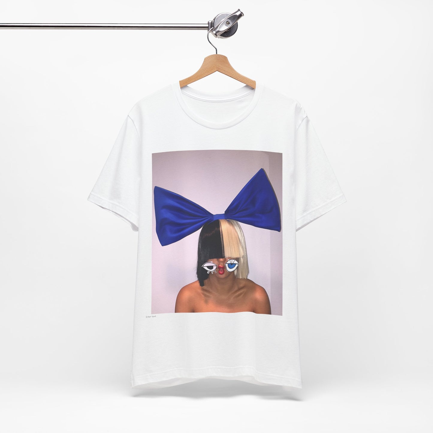 A black graphic t-shirt featuring a graphic of Sia with her iconic wig, in an aesthetic style.