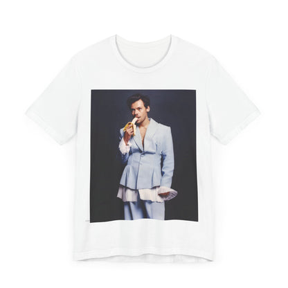 A black graphic t-shirt featuring a graphic related to Harry Styles and his One Direction legacy.