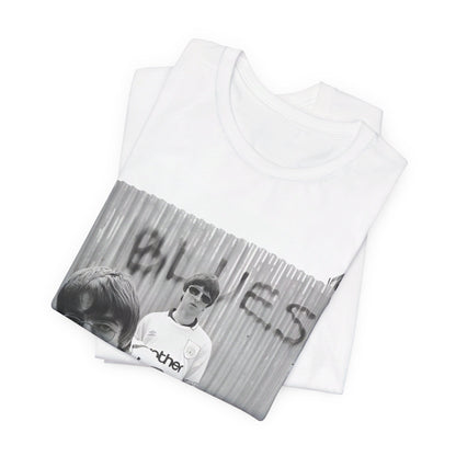 A black graphic t-shirt featuring a graphic of Liam and Noel Gallagher from Oasis, showing their support for Manchester City.