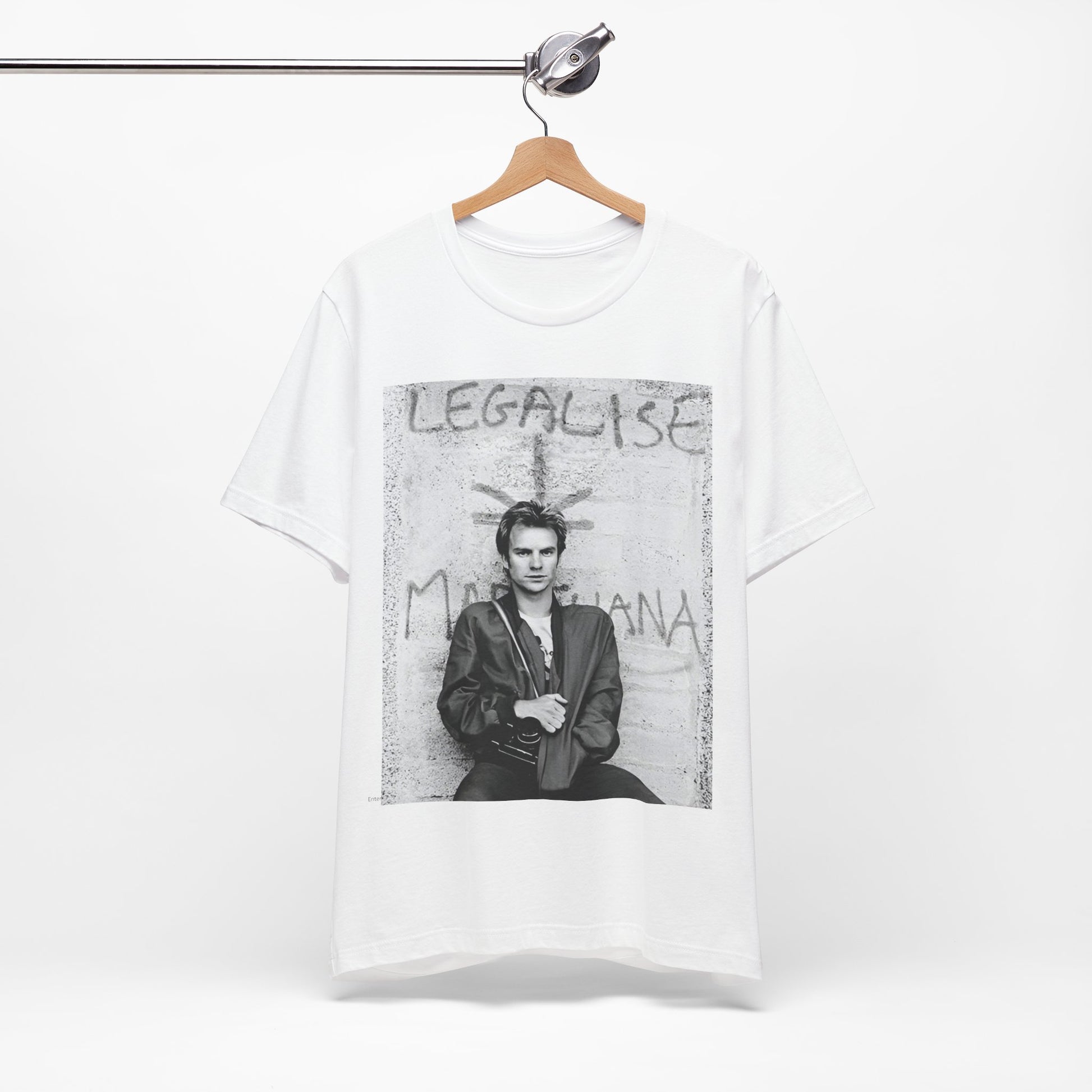 A black graphic t-shirt featuring a graphic of The Police with reggae-influenced pop elements.