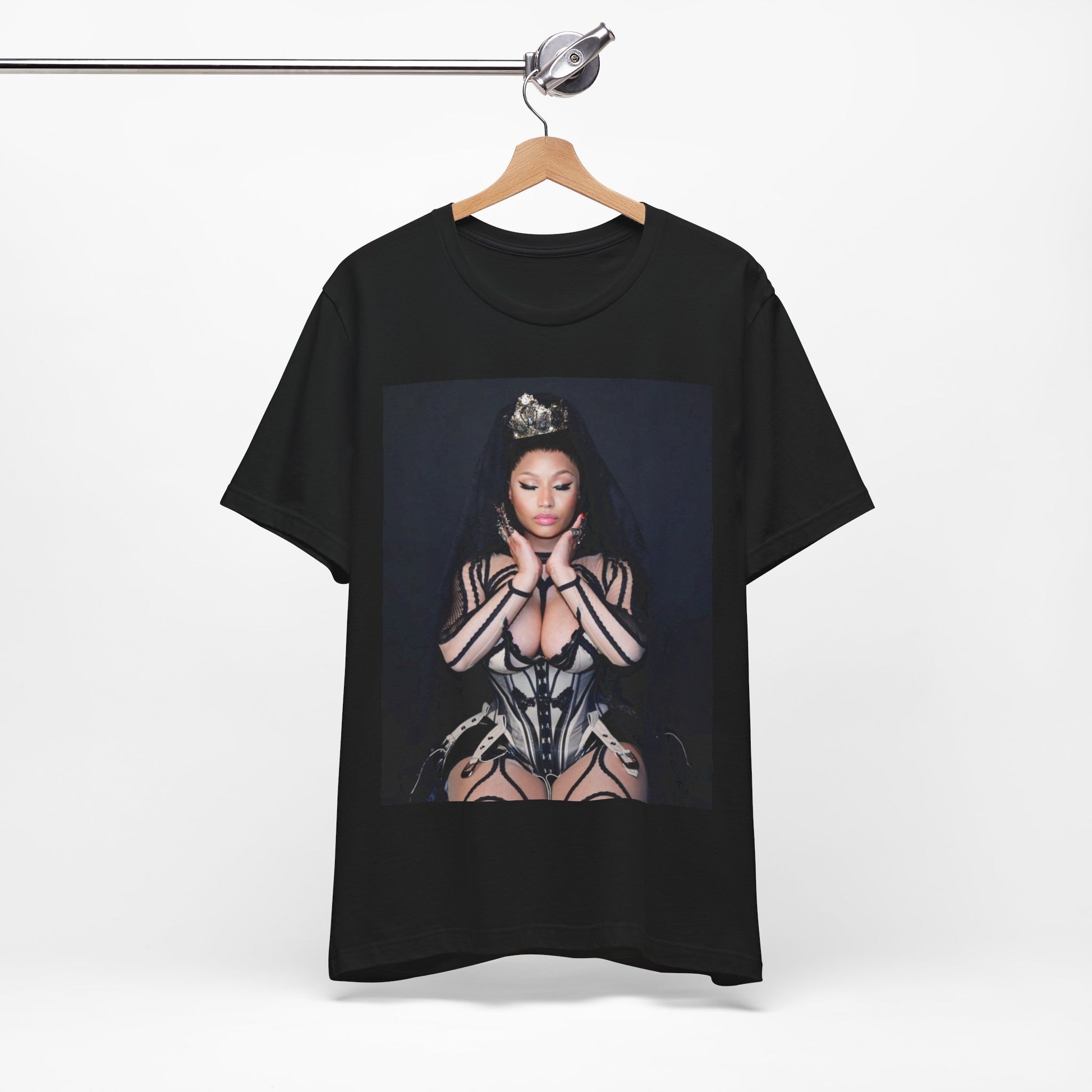 A black graphic t-shirt featuring a vintage graphic of Nicki Minaj as the Queen of Rap.