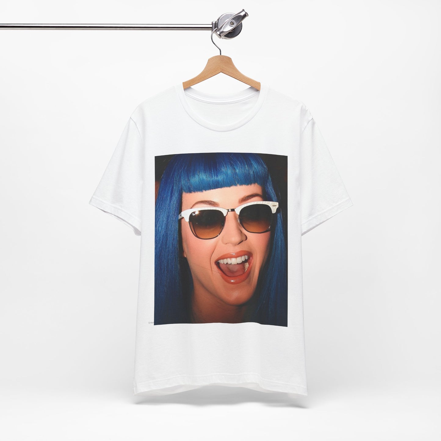 A black graphic t-shirt featuring a retro graphic of Katy Perry with blue hair.