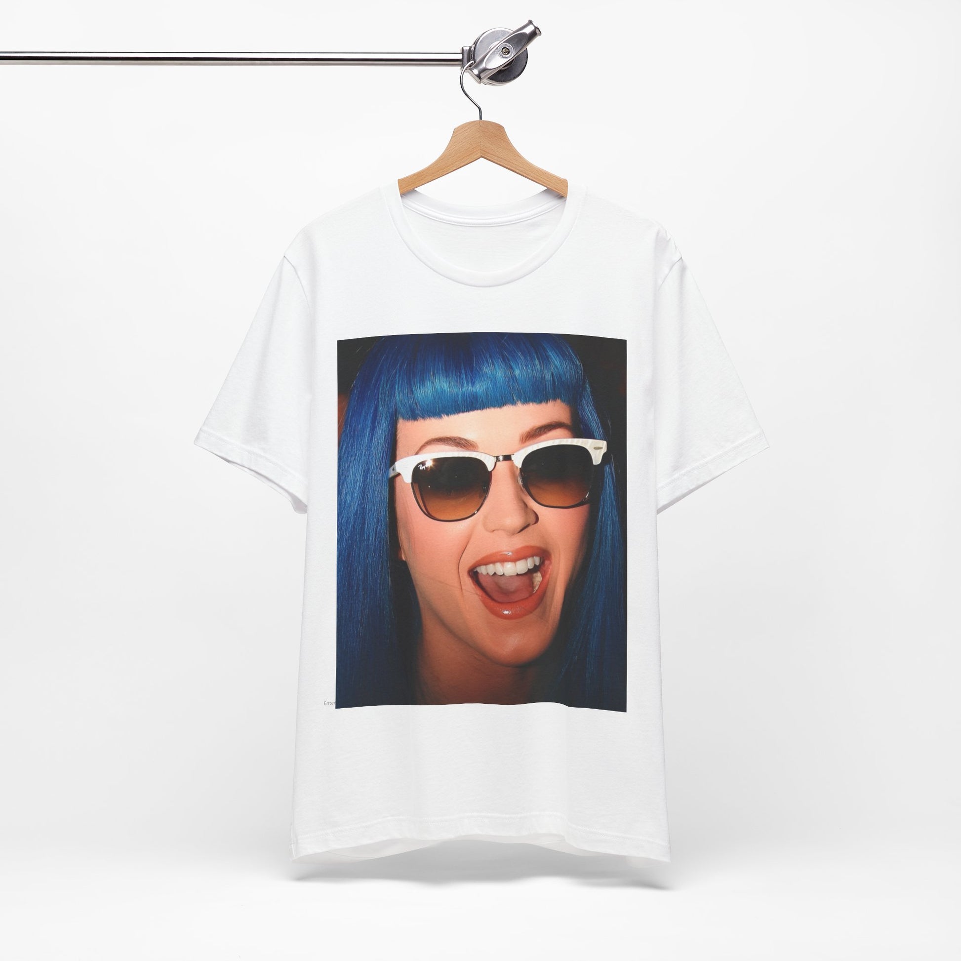 A black graphic t-shirt featuring a retro graphic of Katy Perry with blue hair.