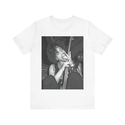 A black graphic t-shirt featuring a graphic or photo of Prince performing wildly on stage.