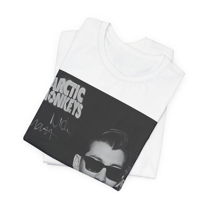 A black graphic t-shirt featuring a black and white portrait photo of Alex Turner from Arctic Monkeys, showing his signature look.