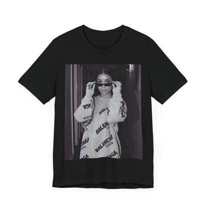 A black graphic t-shirt featuring a black and white, monochrome graphic or photo of Jhene Aiko.