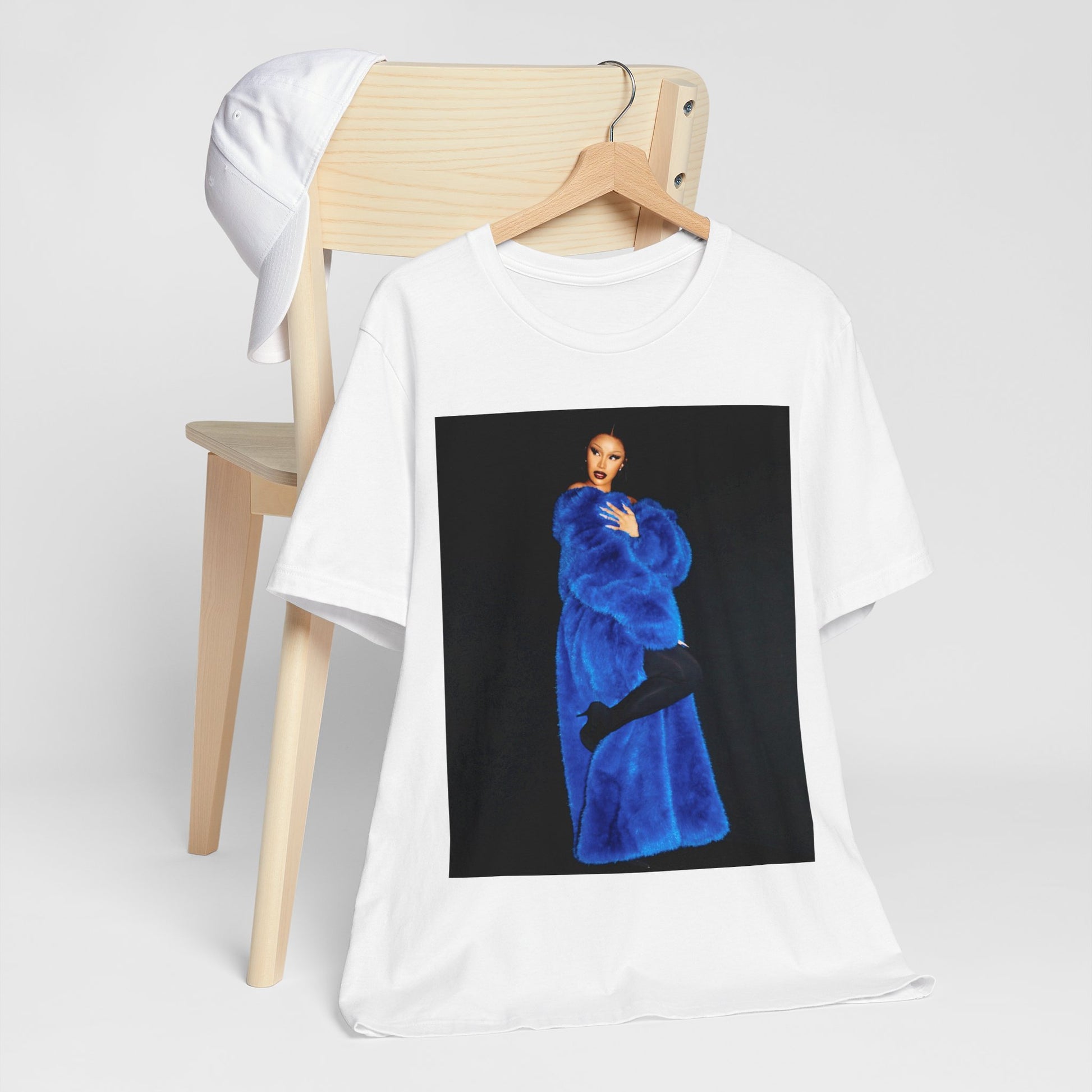 A black graphic t-shirt featuring a photo of Cardi B, possibly with blue velvet elements or a luxurious blue aesthetic.