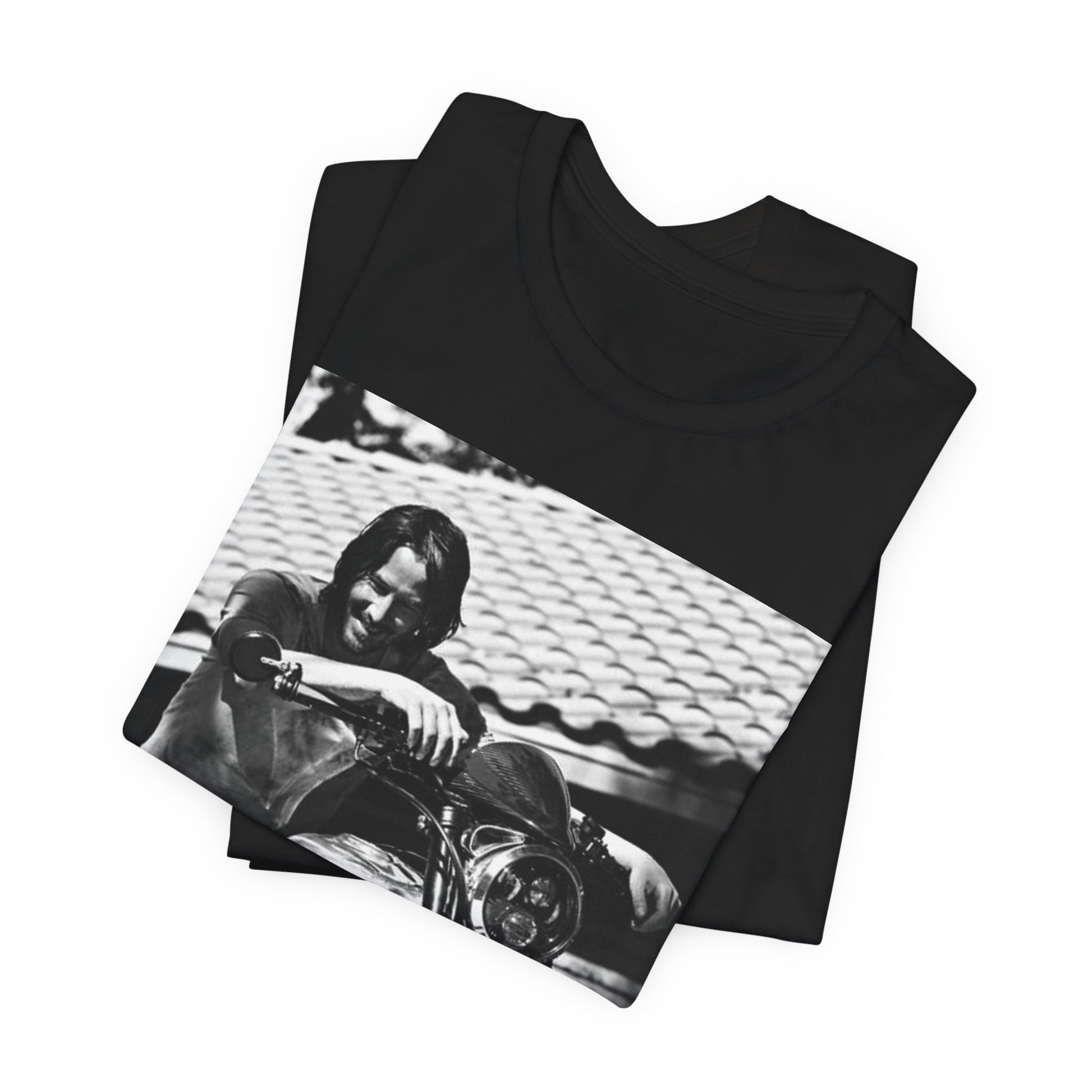 A black graphic t-shirt featuring a black and white photo of Keanu Reeves on a motorcycle.